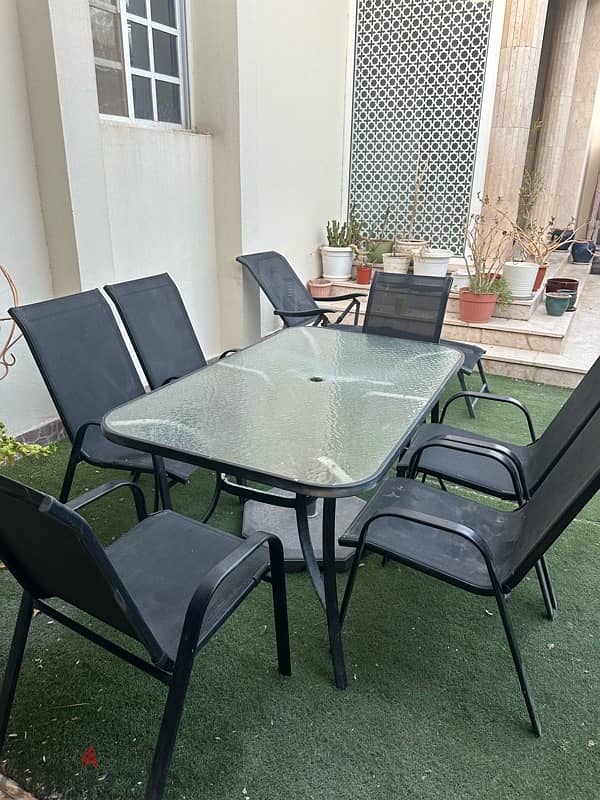 table with 6 chairs and swing 5