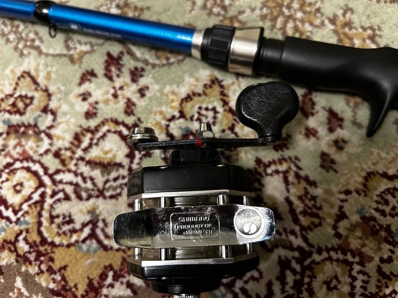 Shimano baitcasting fishing reel with rod 1