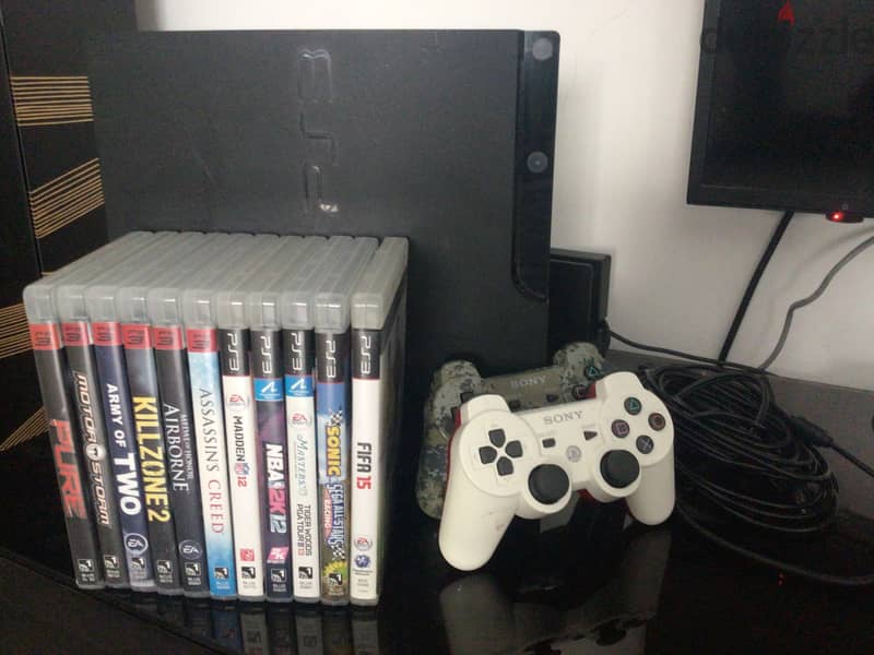 PS3 slim with 12 games and 2 controllers 0