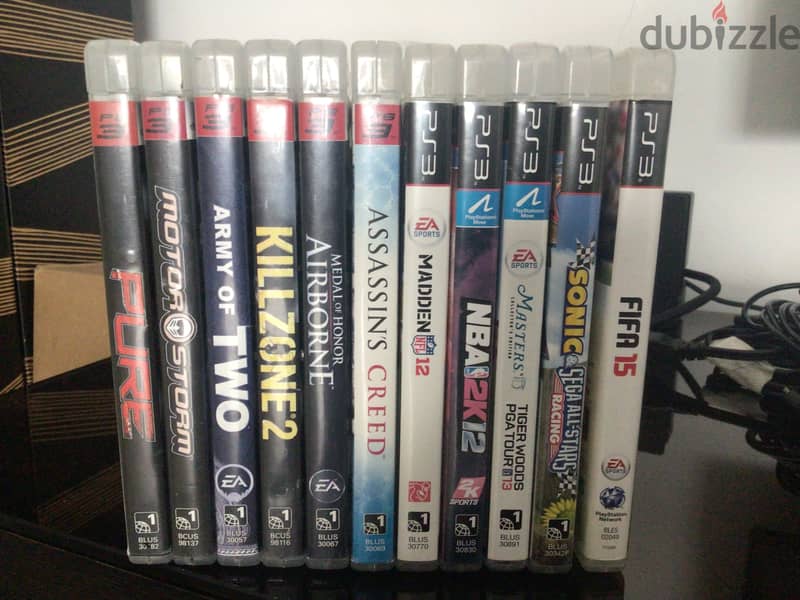 PS3 slim with 12 games and 2 controllers 2