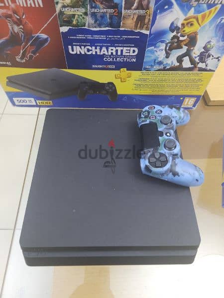 Playstation 4 500 GB with 6 games 2 controllers and used headset 2