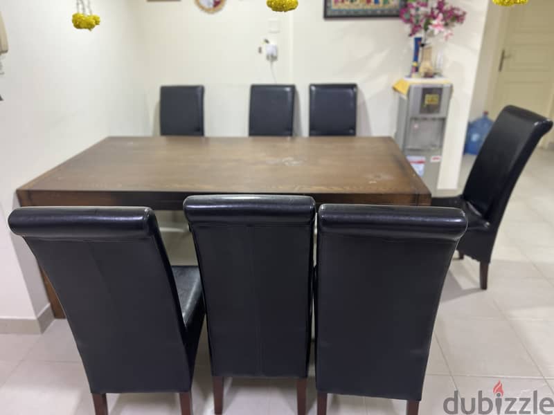 Dining table in Good condition with 8 chairs soft cushion 1