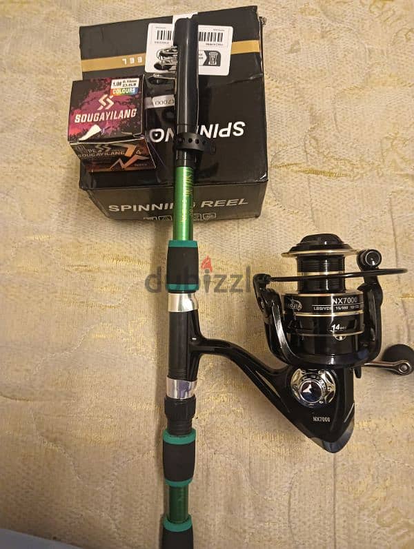 7000spining reel with stick full new condition 1