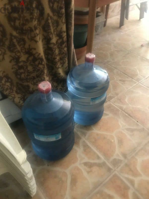 water cooler for sale good condition wit 2 bottles of water for 10 bd 0