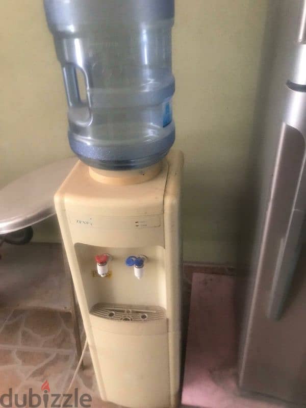 water cooler for sale good condition wit 2 bottles of water for 10 bd 1