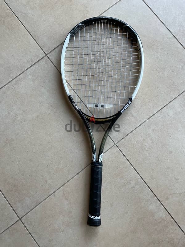 tennis rackets and ball basket 7