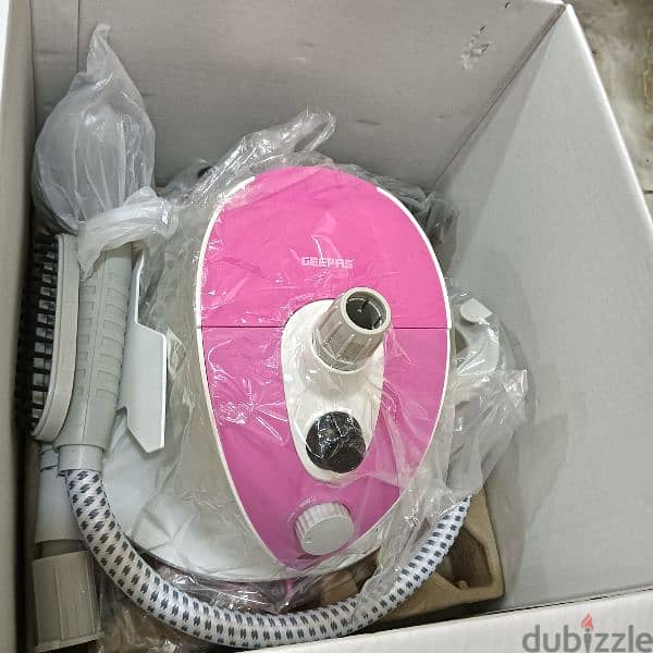 Garment steamer color white and pink color 0