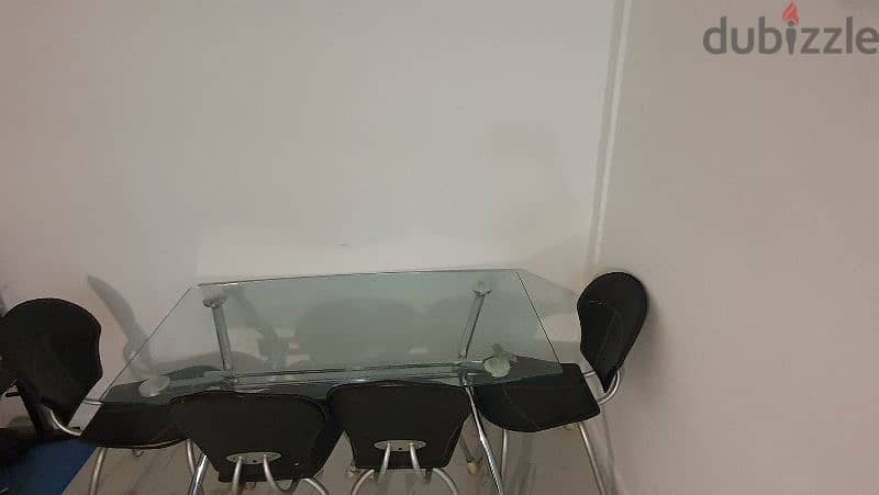 glass dining table with 4 chairs in Good condition 3