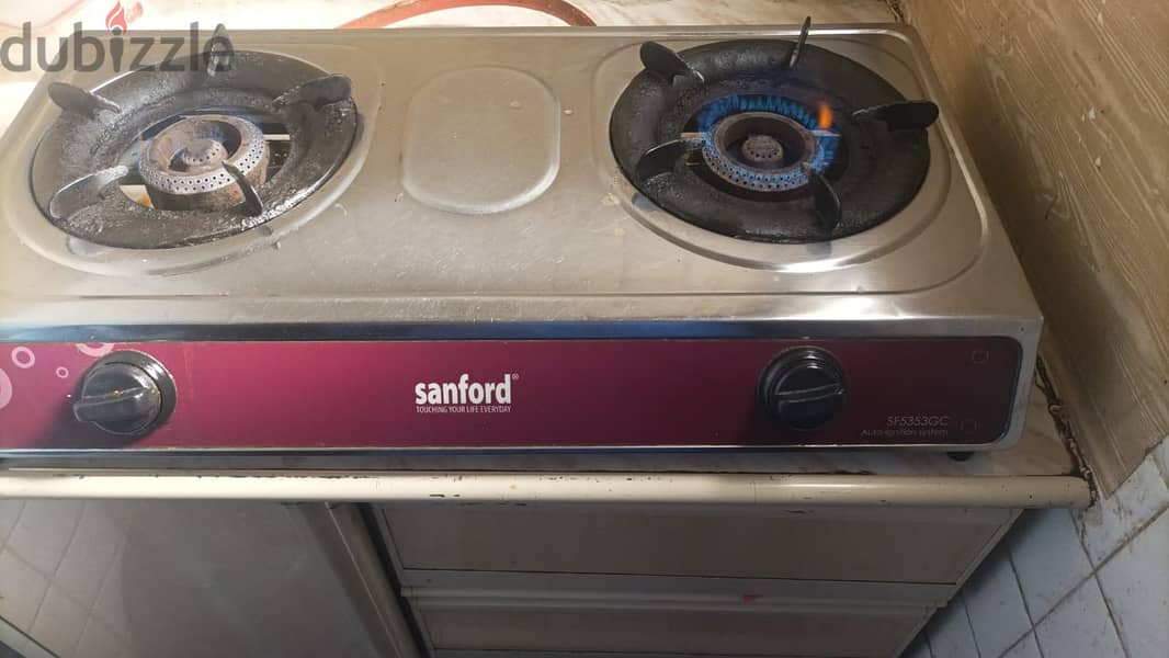 22 KG Gas Cylinder with Regulator and also Sanford 2-Burner Stove 5