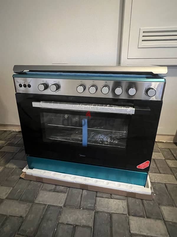 Midea Freestanding Cooker with 5 Gas Burner 0