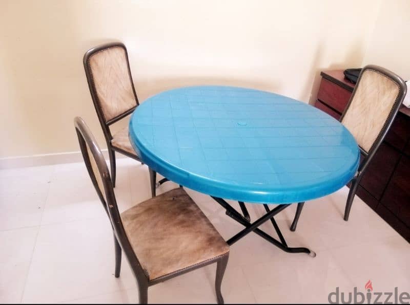 plastic dining table with three chairs 0