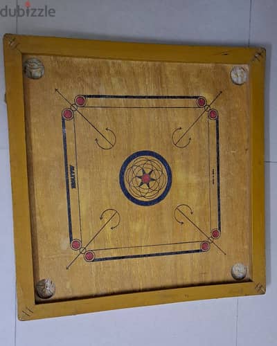 carrom board with coins