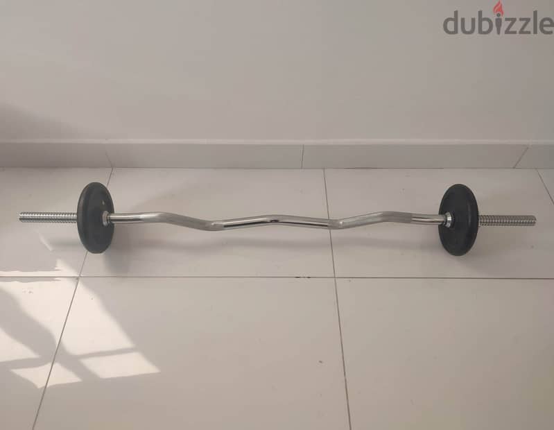 Curled barbell with weights 0