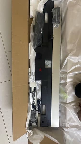 Sony UNUSED TV stand with speaker for sale.