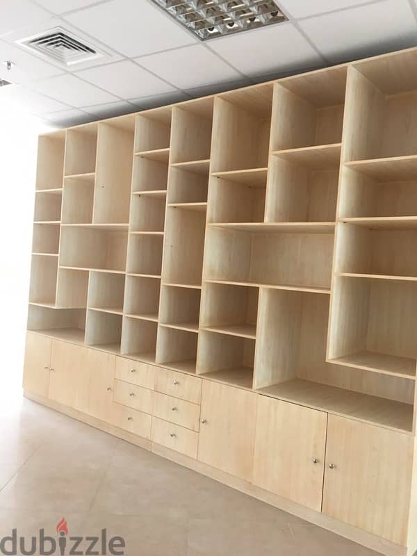 beige wood shelves and cupboards for shop 1