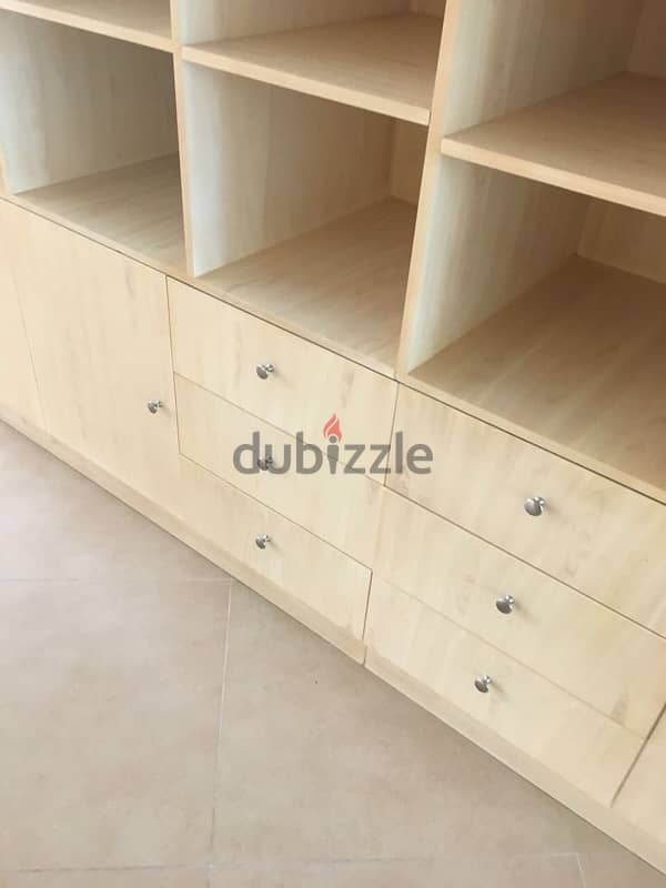 beige wood shelves and cupboards for shop 2