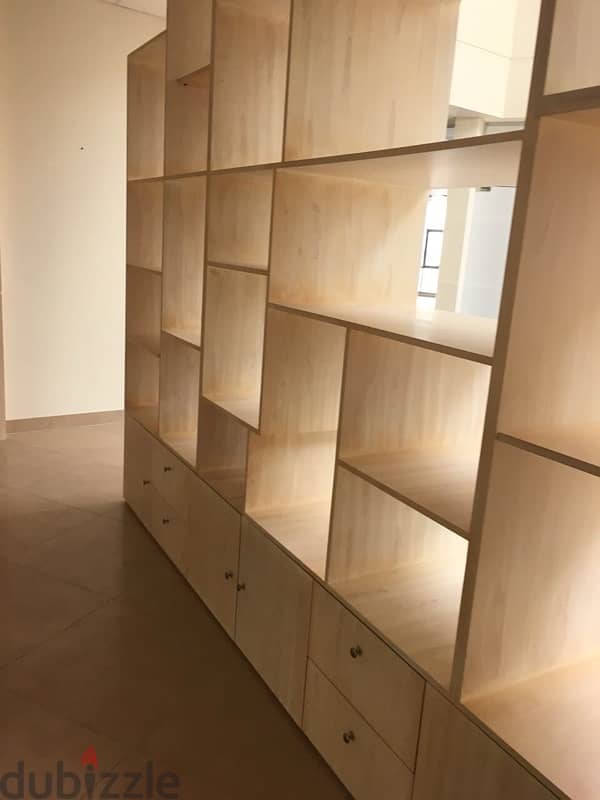 beige wood shelves and cupboards for shop 3