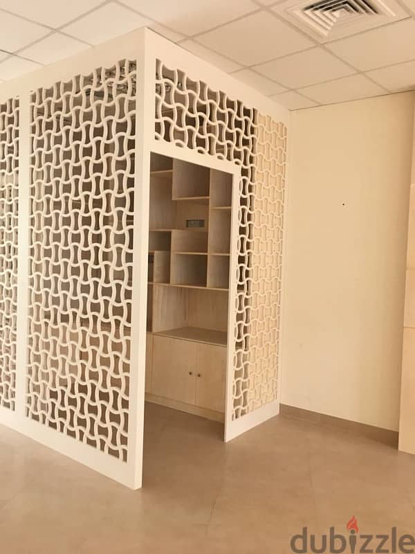 beige wood shelves and cupboards for shop 5