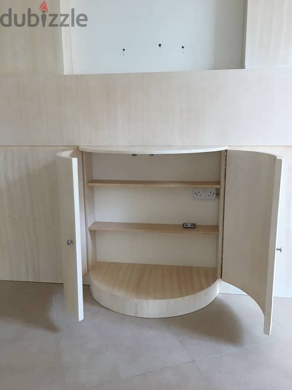 beige wood shelves and cupboards for shop 10