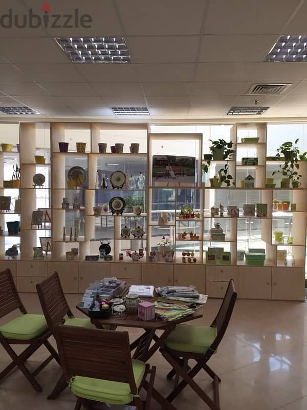 beige wood shelves and cupboards for shop 12