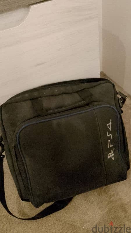 PS4 with games and bag 1