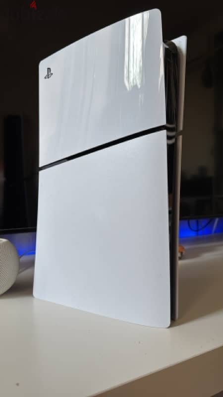 PlayStation 5 slim with cosmic blue controller 2