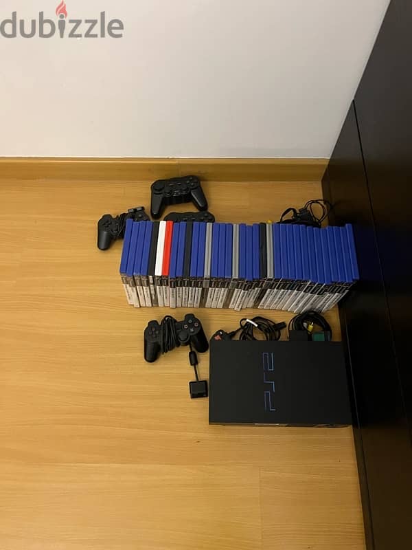 PS2 with 35 games 2 controllers and all cables included 3