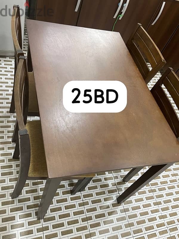 Dinning table with 4 chairs in good condition pick up from hamad town 0