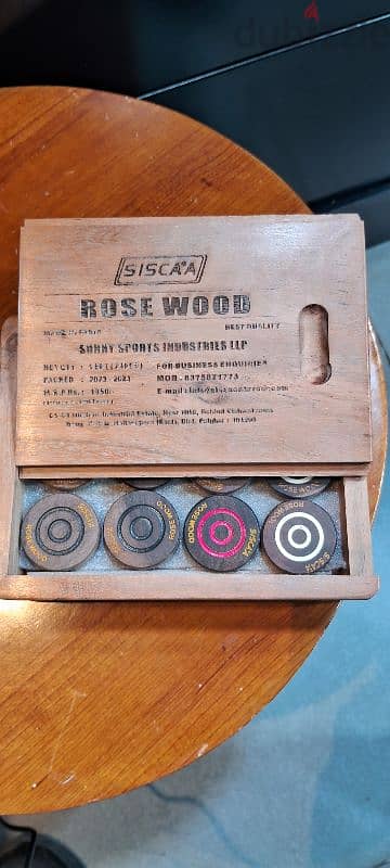 carrom coins rose. wood siscaa 2