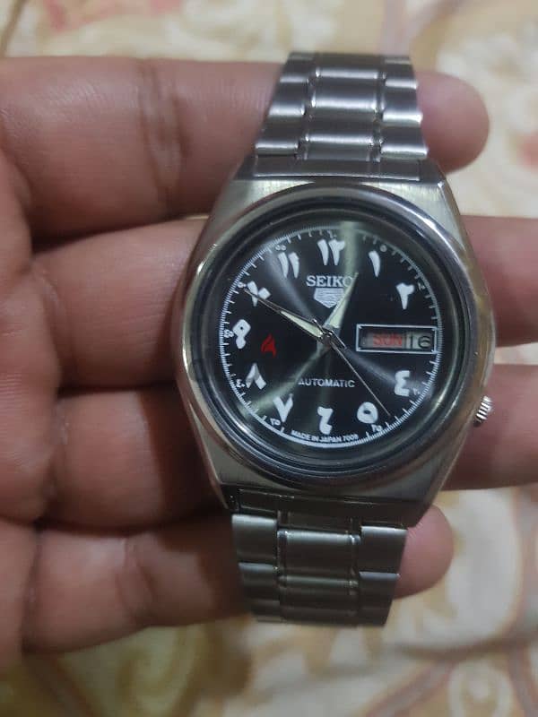 man watch seiko5 0