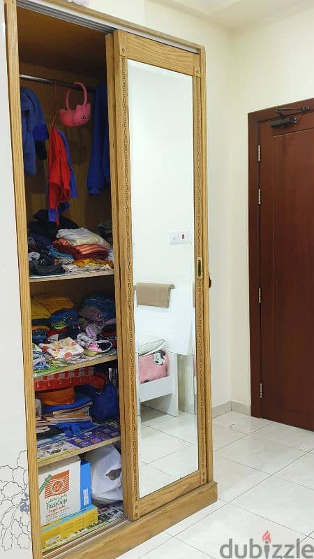 Wooden cupboard with sliding door and soft bed for sale 1