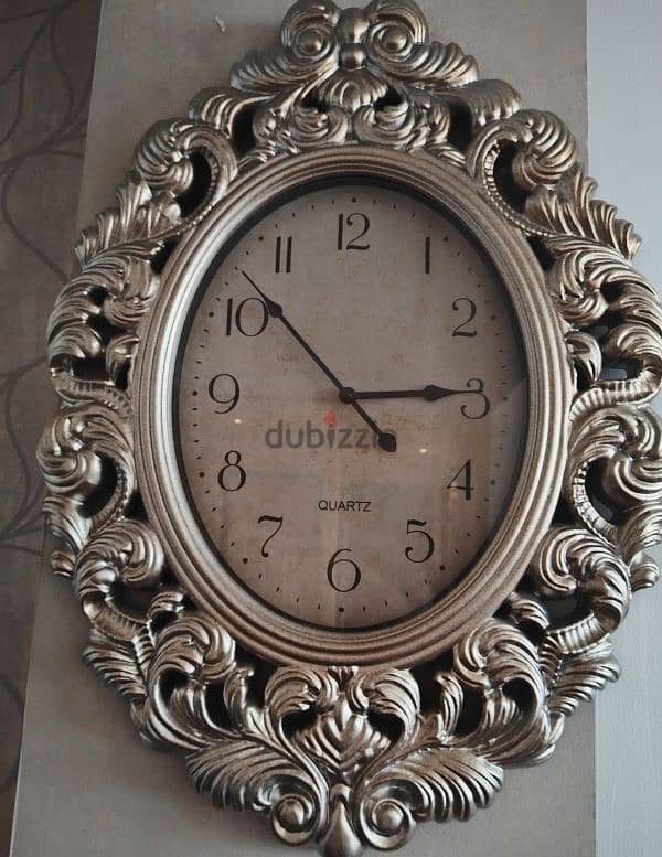 A big & beautiful wall clock selling for 5 bd. 1