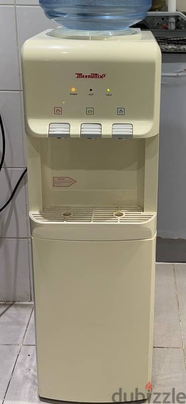 water dispenser with hot & cold options & storage also