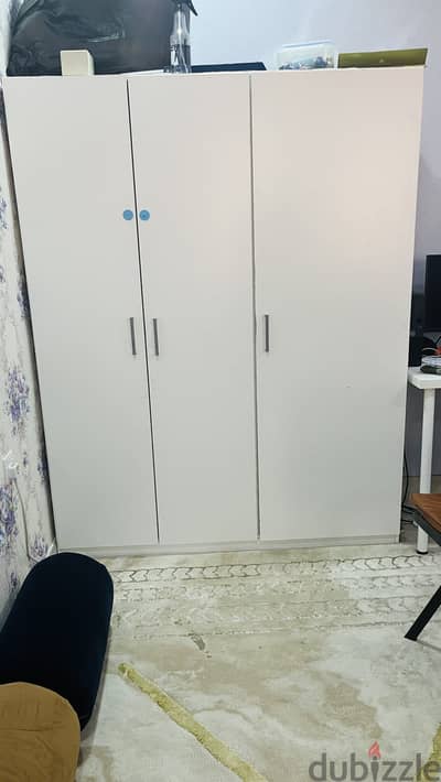 Cupboard and single bed