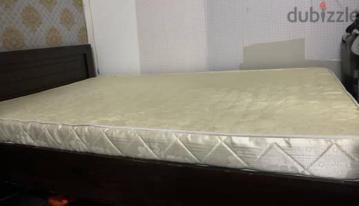 Double bed with new mattress and small drawer.