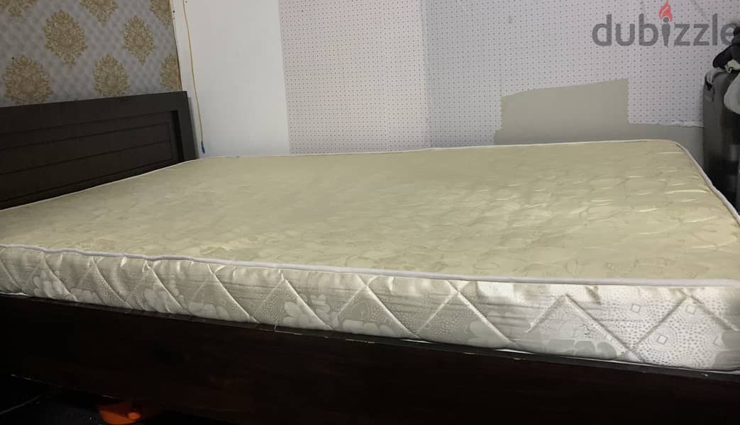 Double bed with new mattress and small drawer. 0