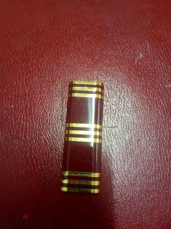 Cartier lighter, red laquer & gold-plated horizontal line design 1