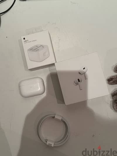 AirPods case with charging block, cable and box