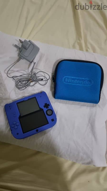 2ds blue console in great condition with silicon protector and its bag 0