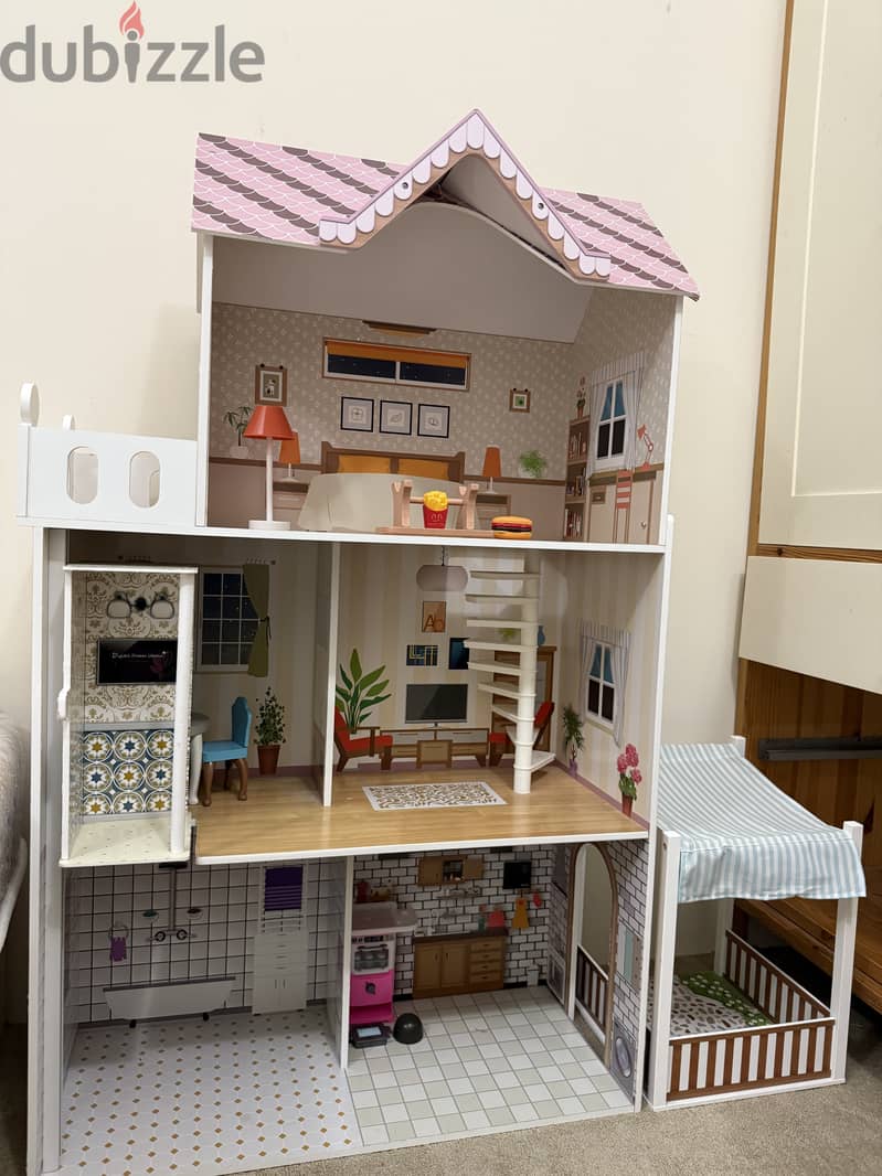 DOLL HOUSE WITH WOODEN FURNITURE AND ALL ACCESSORIES . 1