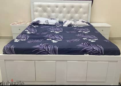 bed with mattress and 2 side table