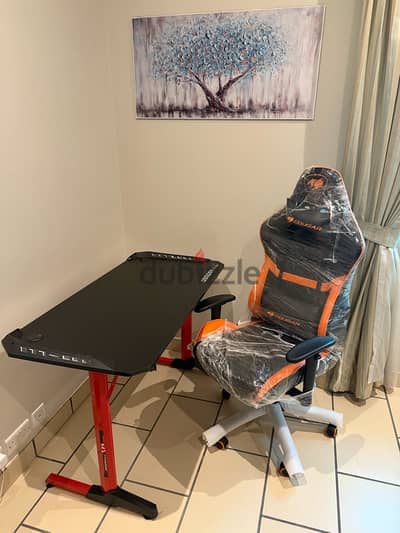 cougar gaming chair and deadskull gaming table