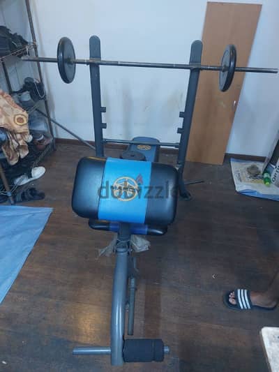 bench free for sell with 7 plate and rod