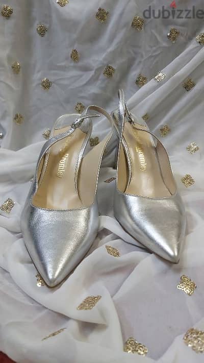 Preowned Russell & bromley silver sling back heels. Size  39.5. 25BD