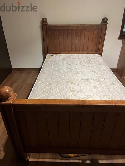 single bed with mattress and headboard