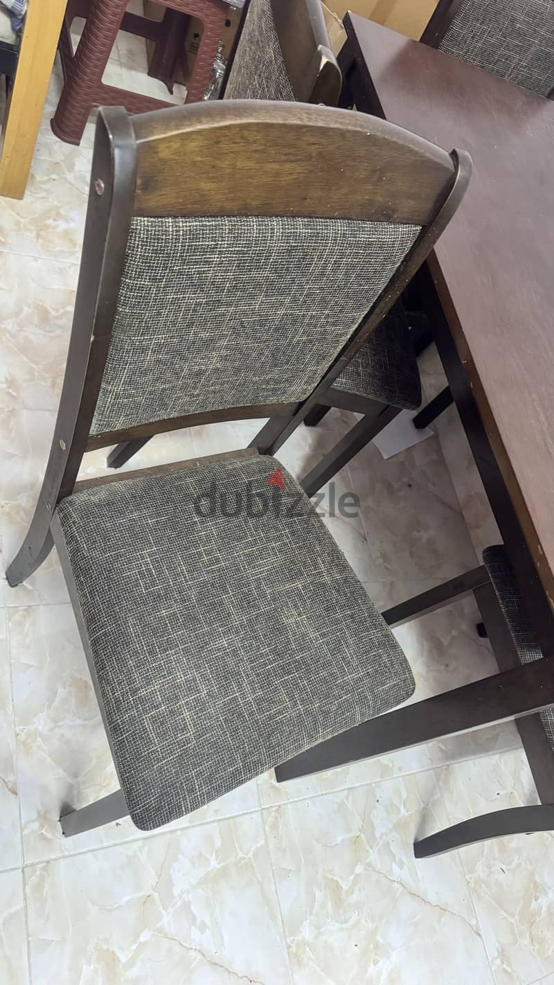 Wooden Dinning table with 4 chairs. 1