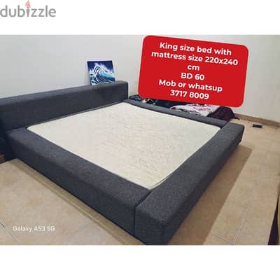 King size bed with mattress and other household items for sale