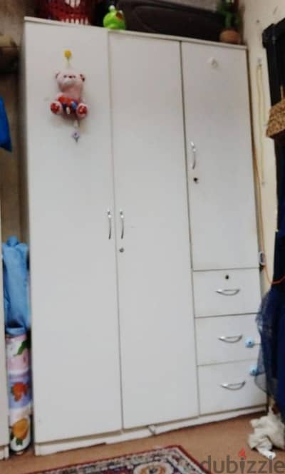 3 door white cupboard with locks one lock desk in new condition