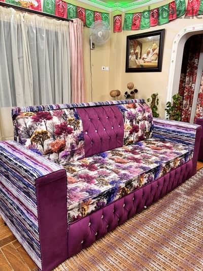 Stylish and comfortable purple sofa with a modern design. High quality