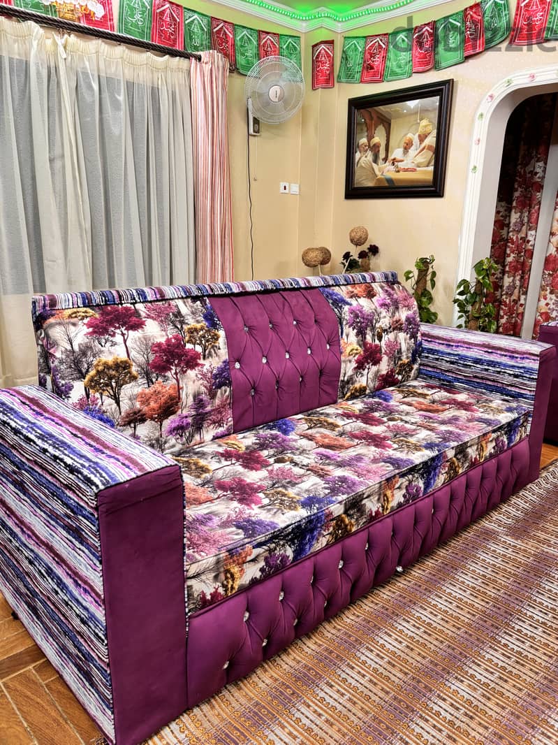 Stylish and comfortable purple sofa with a modern design. High quality 0